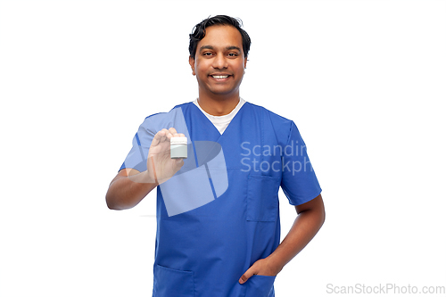 Image of indian doctor or male nurse holding medicine