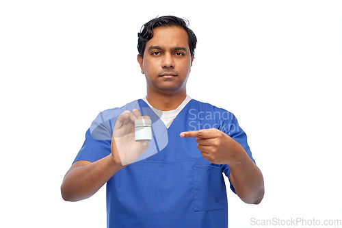 Image of indian doctor or male nurse holding medicine