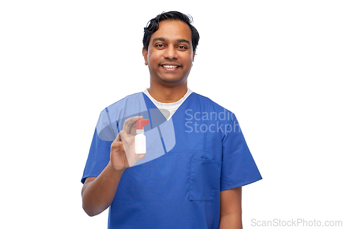 Image of smiling indian male doctor or nurse with medicine