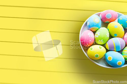 Image of close up of colored easter eggs on plate