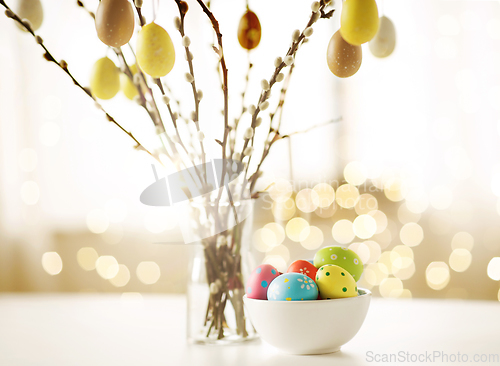 Image of pussy willow branches decorated by easter eggs