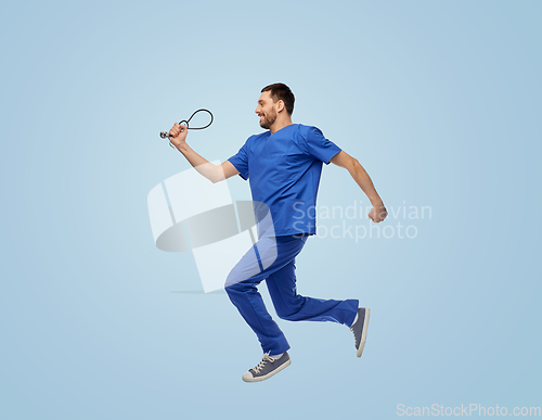 Image of doctor or male nurse with stethoscope jumping