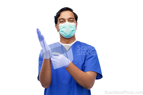 Image of indian male doctor in uniform, mask and gloves