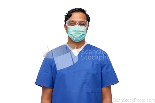 Image of indian male doctor in blue uniform and mask