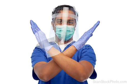 Image of indian male doctor in mask and face shield