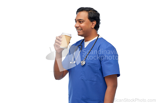 Image of male doctor with stethoscope drinking coffee