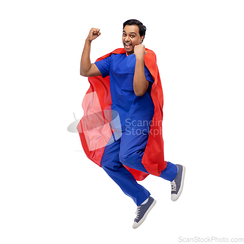 Image of doctor or male nurse in superhero cape jumping