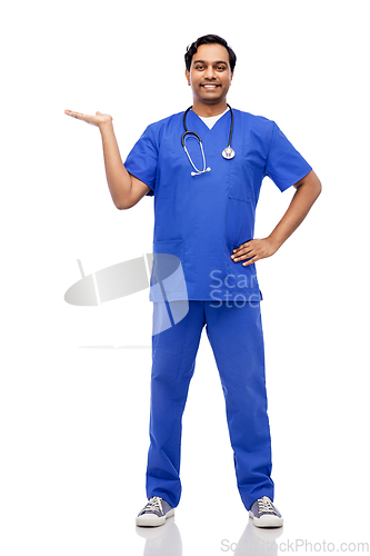 Image of happy indian male doctor holding something on hand