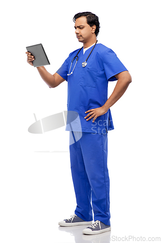 Image of doctor or male nurse using tablet computer