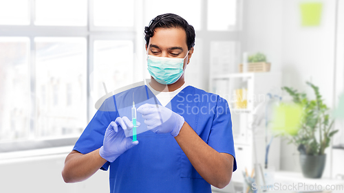 Image of indian male doctor in mask with vaccine in syringe