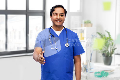 Image of happy indian male doctor giving hand for handshake