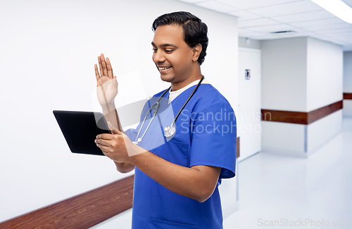 Image of doctor or male nurse has video call on tablet pc