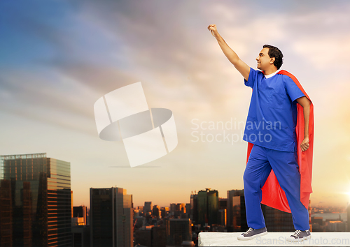 Image of smiling doctor or male nurse in superhero cape