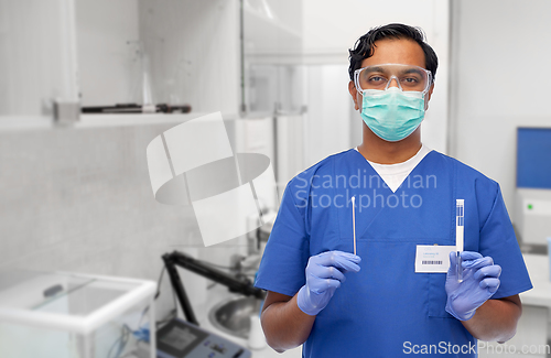 Image of male doctor in mask with cotton swab and test tube