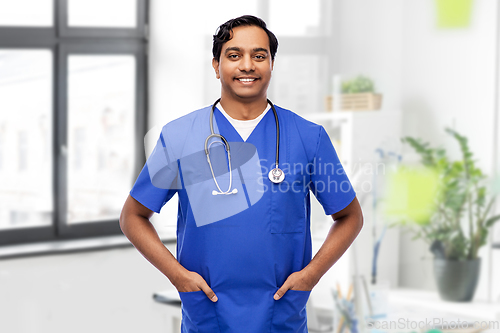 Image of happy indian doctor or male nurse with stethoscope