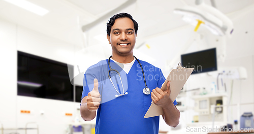 Image of smiling doctor or male nurse showing thumbs up