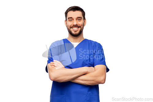 Image of happy smiling doctor or male nurse in blue uniform