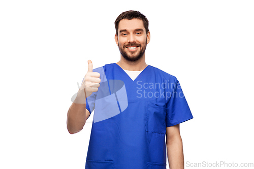 Image of happy smiling male doctor showing thumbs up