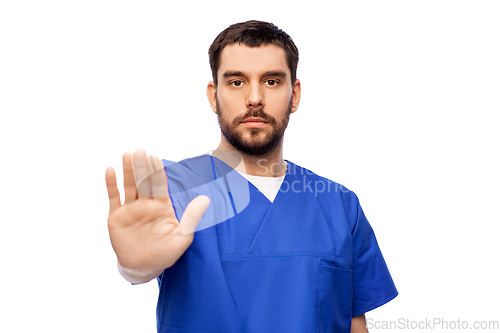 Image of doctor or male nurse showing stop gesture