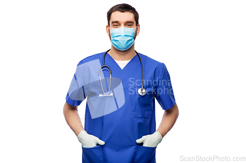 Image of male doctor in blue uniform, mask and gloves