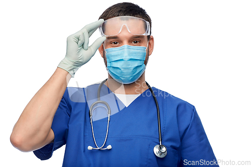 Image of male doctor in goggles, mask and gloves