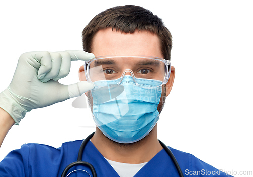 Image of male doctor in goggles, mask and gloves