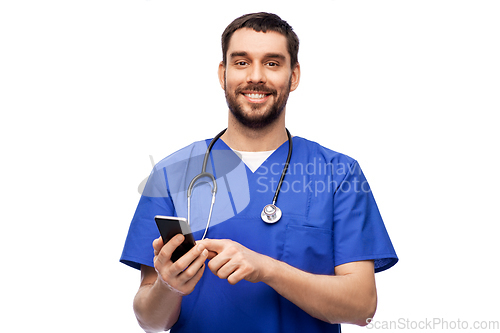 Image of smiling doctor or male nurse using smartphone