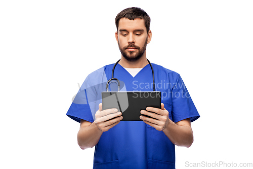 Image of doctor or male nurse using tablet computer