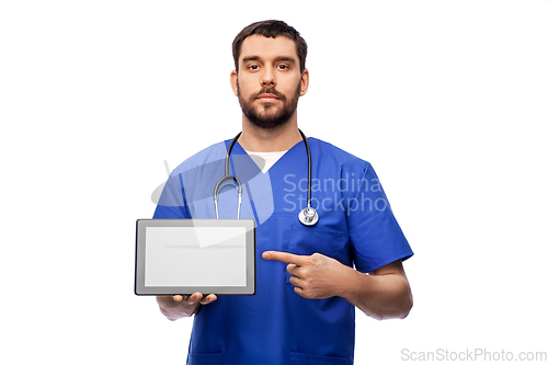 Image of doctor or male nurse showing tablet computer