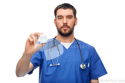 Image of doctor or male nurse with medicine and stethoscope