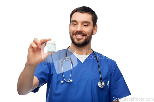 Image of doctor or male nurse with medicine and stethoscope