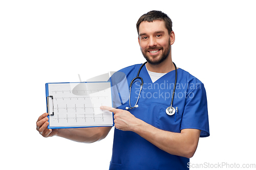 Image of smiling male doctor with cardiogram on clipboard