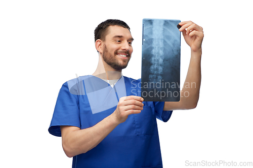 Image of happy smiling doctor or male nurse with x-ray