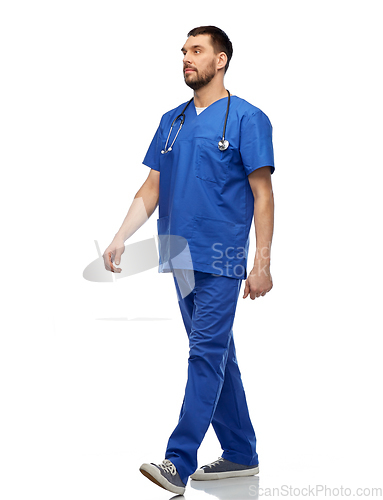 Image of doctor or male nurse with stethoscope walking
