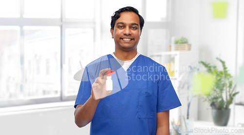 Image of smiling indian male doctor or nurse with medicine