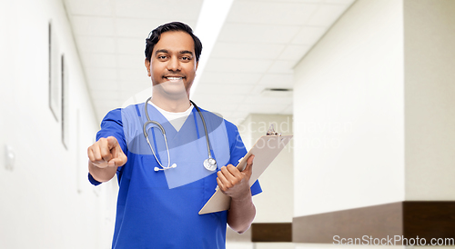 Image of indian doctor or male nurse pointing to camera