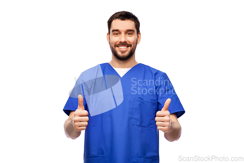 Image of happy smiling male doctor showing thumbs up