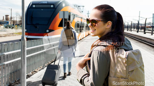 Image of woman with backpack traveling by train in estonia