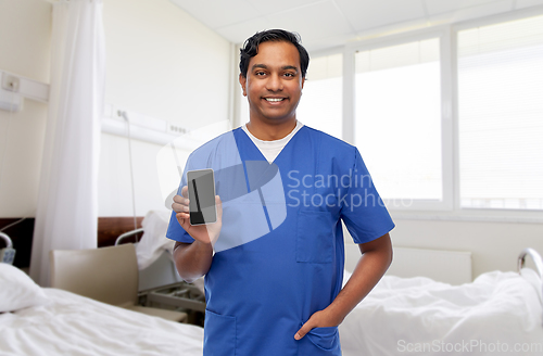 Image of happy doctor or male nurse with phone at hospital