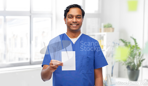 Image of indian doctor or male nurse with prescription