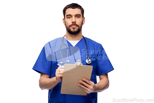 Image of male doctor writing medical report on clipboard