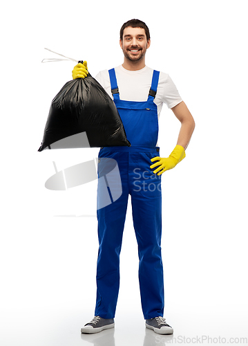 Image of happy male worker or cleaner with garbage bag