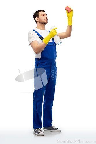 Image of male cleaner cleaning with sponge and detergent