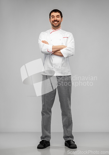 Image of happy smiling male chef in jacket