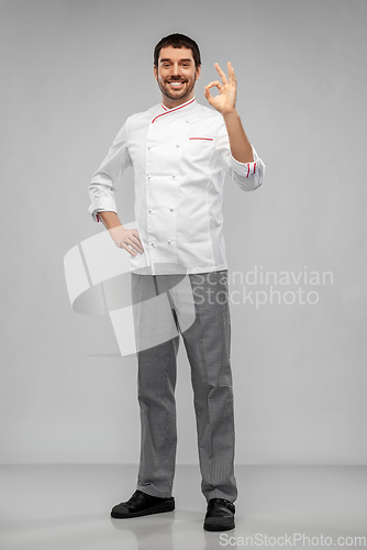 Image of happy smiling male chef showing ok hand sign