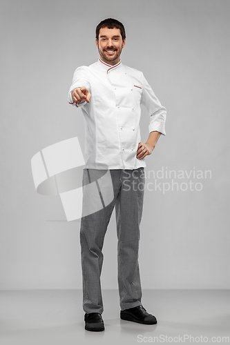 Image of happy smiling male chef in jacket