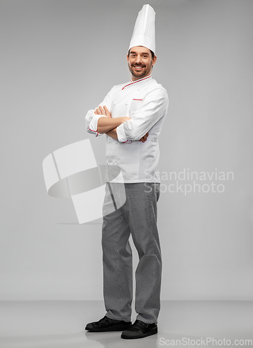 Image of happy smiling male chef in toque