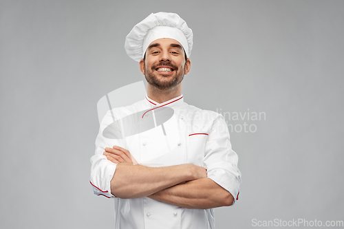 Image of happy smiling male chef in toque