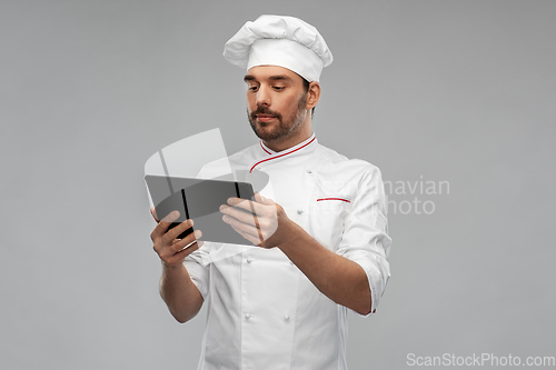 Image of male chef with tablet pc computer