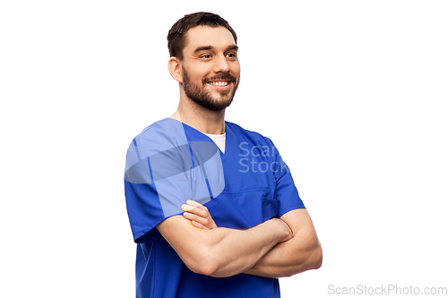 Image of happy smiling doctor or male nurse in blue uniform